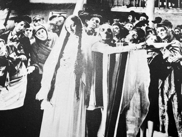 he iconic moment of Judith Berg dancing as death (in stripes and masked) behind the bride in the 1937 film “The Dybbuk